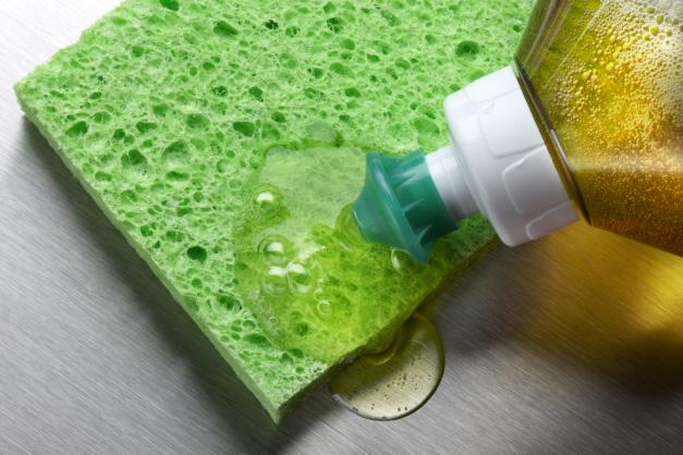 Dish soap being put on a sponge
