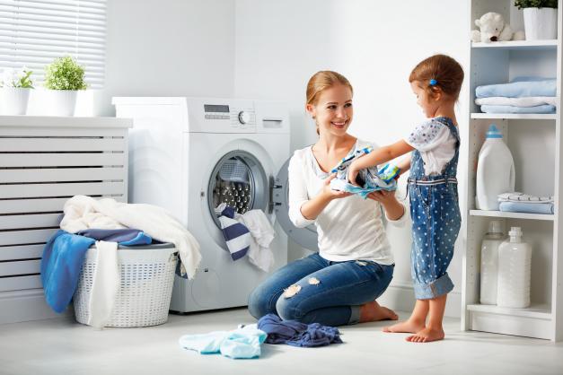 Mother and daughter doing laundry