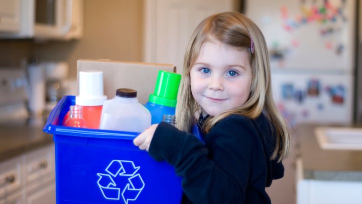 Girl with a box of recycling