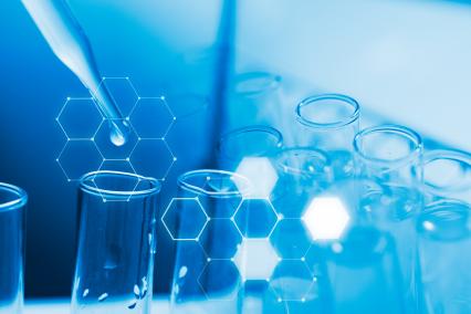 A pipette putting drops into a test tube